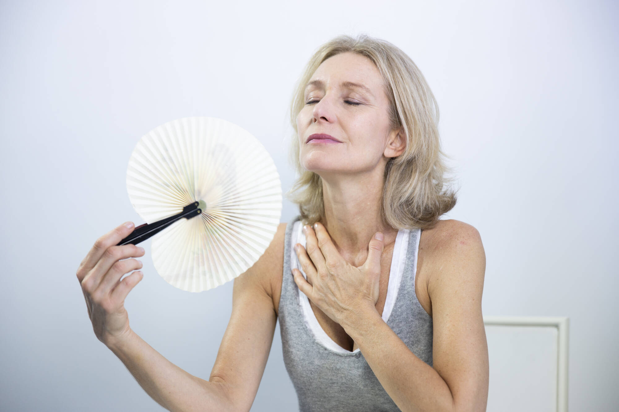 Menopause woman having a hot flush