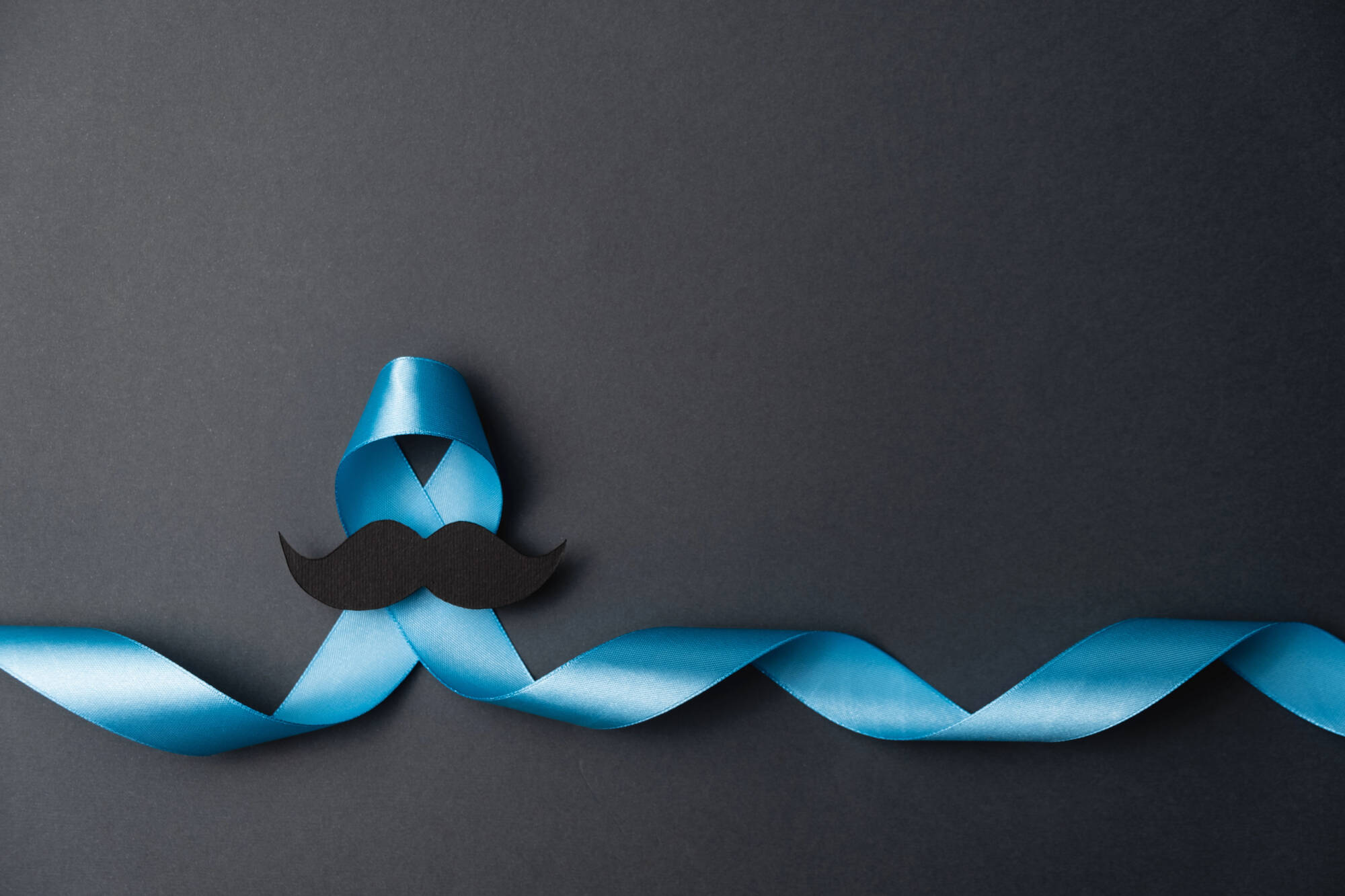 Prostate cancer blue ribbon with a moustache