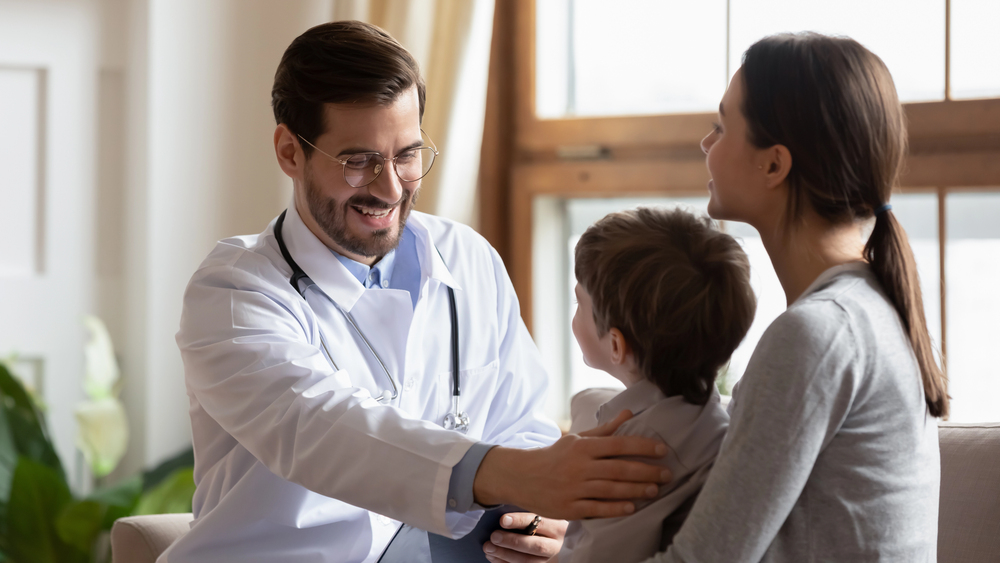 Private GP with mother and child